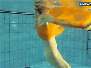 Yellow and red dressed teenage underwater
